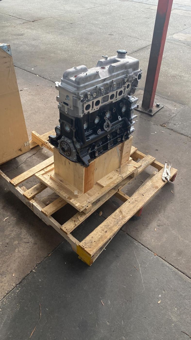Replacement engine on a pallet ready for installation