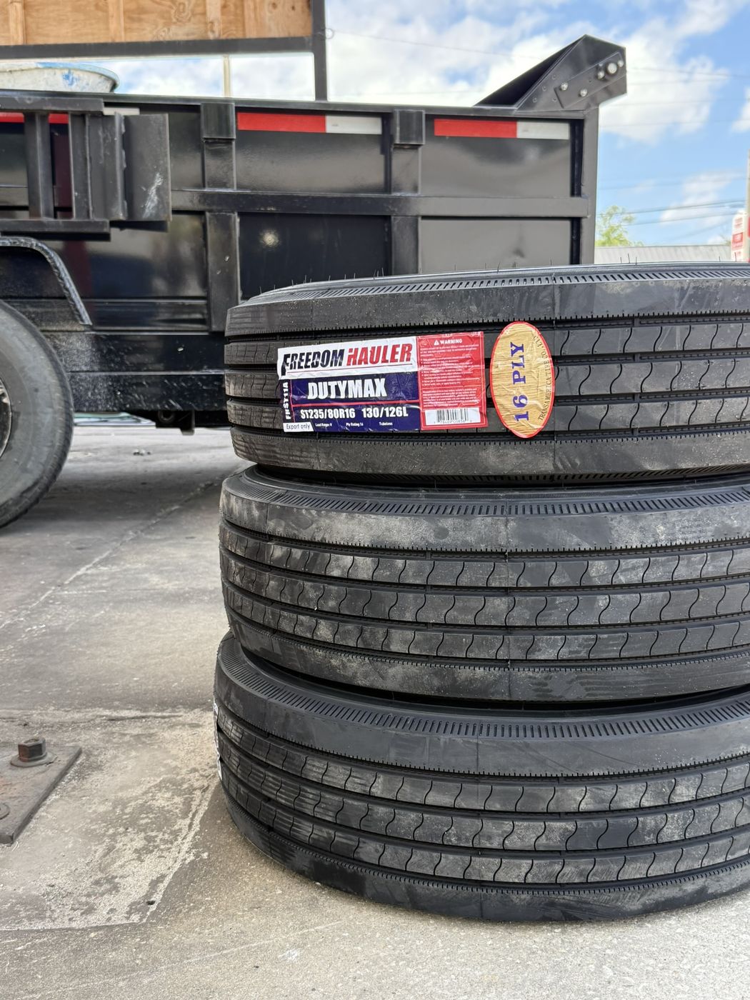 Stack of new 16-ply heavy-duty trailer tires